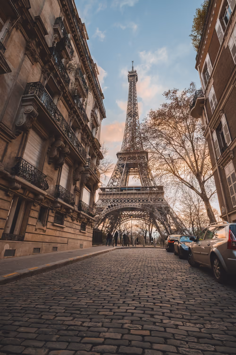 The Eiffel Tower at the end of a Paris street
